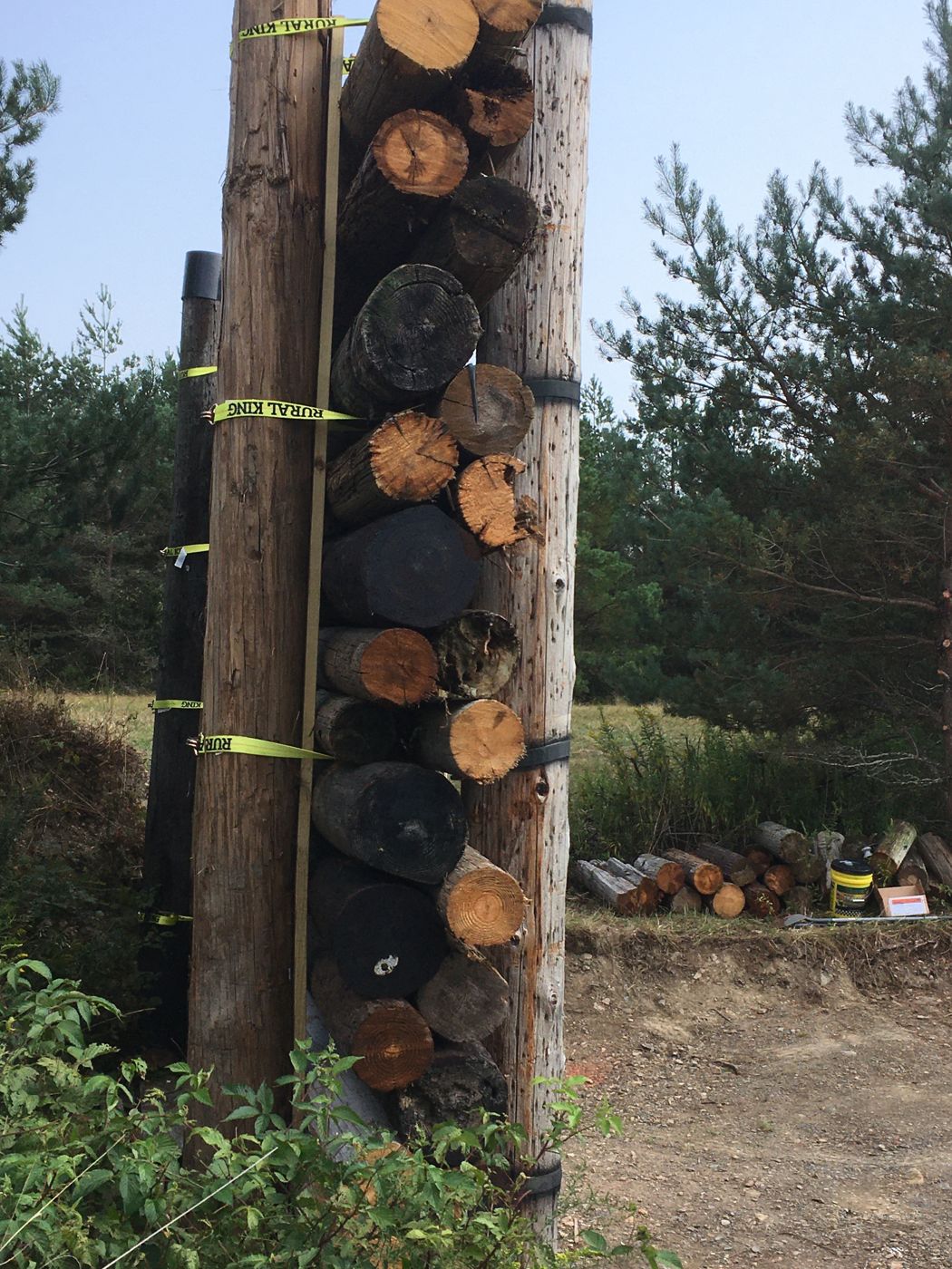 Stack of power poles strapped together